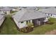 Rear view of home showcasing screened patio and landscaping at 18040 Cherished Loop, Bradenton, FL 34211