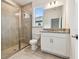 Clean bathroom with a walk-in shower and white vanity at 18040 Cherished Loop, Bradenton, FL 34211