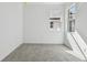 Bright bedroom with grey carpet and two windows at 18040 Cherished Loop, Bradenton, FL 34211