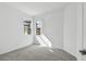 Spacious bedroom with grey carpet and large windows at 18040 Cherished Loop, Bradenton, FL 34211