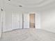 Bright bedroom with grey carpet and double door closet at 18040 Cherished Loop, Bradenton, FL 34211