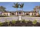 Community clubhouse with stone accents and palm trees at 18040 Cherished Loop, Bradenton, FL 34211