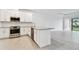 Bright kitchen featuring stainless steel appliances and granite countertops at 18040 Cherished Loop, Bradenton, FL 34211