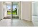 Sliding glass doors open to a paved patio area at 18040 Cherished Loop, Bradenton, FL 34211