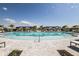 Resort-style pool with plenty of seating and umbrellas at 18040 Cherished Loop, Bradenton, FL 34211