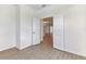 Bedroom with wood-look floors and access to another room at 18178 Cherished Loop, Bradenton, FL 34211