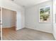 Light and airy bedroom with wood-look floors at 18178 Cherished Loop, Bradenton, FL 34211