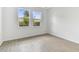 Well-lit bedroom with two windows and wood-look floors at 18178 Cherished Loop, Bradenton, FL 34211