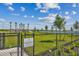 Fenced dog park for residents and their guests; features lake view at 1885 Bilge Ln, Sarasota, FL 34240