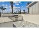 Outdoor grilling station with granite countertop and stainless steel grill at 1885 Bilge Ln, Sarasota, FL 34240