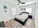 Modern bedroom with a queen bed and wood-look floors at 2217 Thrace St, Tampa, FL 33605