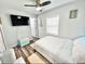 Bedroom with a queen bed and wood-look floors at 2217 Thrace St, Tampa, FL 33605