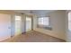 Bright bedroom with ample closet space and carpet flooring at 2275 Pine View Cir, Sarasota, FL 34231