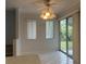 Bright dining room with tile floors, ceiling fan, and sliding glass doors at 2275 Pine View Cir, Sarasota, FL 34231