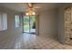 Spacious dining area with tile floor and access to backyard at 2275 Pine View Cir, Sarasota, FL 34231