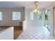 Dining area with tile floors and sliding glass doors to backyard at 2275 Pine View Cir, Sarasota, FL 34231