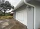 White garage door with gray trim at 2275 Pine View Cir, Sarasota, FL 34231