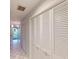 Hallway with tile floors and built-in storage at 2275 Pine View Cir, Sarasota, FL 34231