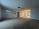 Spacious living room, featuring a chandelier and large windows at 2275 Pine View Cir, Sarasota, FL 34231