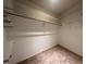 Large walk-in closet with shelves and hanging rod at 2275 Pine View Cir, Sarasota, FL 34231