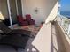 Peaceful balcony with seating and ocean views at 3060 Grand Bay Blvd # 174, Longboat Key, FL 34228