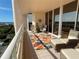 Balcony with wicker furniture and a view, perfect for relaxing outdoors at 3060 Grand Bay Blvd # 174, Longboat Key, FL 34228