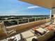 Large balcony boasting scenic water views and comfortable seating at 3060 Grand Bay Blvd # 174, Longboat Key, FL 34228