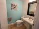 Small bathroom with pedestal sink, toilet, and light-blue walls at 3060 Grand Bay Blvd # 174, Longboat Key, FL 34228