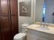 Bathroom boasts a vanity with a large mirror and ample cabinet storage at 3060 Grand Bay Blvd # 174, Longboat Key, FL 34228