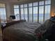 Serene bedroom with large windows and water view at 3060 Grand Bay Blvd # 174, Longboat Key, FL 34228