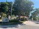 Grand Bay community entrance with guardhouse and lush landscaping at 3060 Grand Bay Blvd # 174, Longboat Key, FL 34228