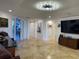 Bright hallway with tile floors and artwork at 3060 Grand Bay Blvd # 174, Longboat Key, FL 34228