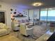 Bright living room with water views and comfortable seating at 3060 Grand Bay Blvd # 174, Longboat Key, FL 34228