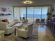 Bright living room, featuring water views and white furniture at 3060 Grand Bay Blvd # 174, Longboat Key, FL 34228