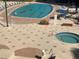 Resort-style pool and spa with lounge chairs at 3060 Grand Bay Blvd # 174, Longboat Key, FL 34228