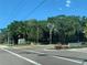 Landscaped entrance to Bay Isles with Publix visible at 3060 Grand Bay Blvd # 174, Longboat Key, FL 34228