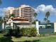 Community tennis courts with building in background at 3060 Grand Bay Blvd # 174, Longboat Key, FL 34228