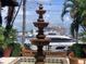 Ornate fountain overlooking marina with boats at 3060 Grand Bay Blvd # 174, Longboat Key, FL 34228