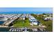 Bird's-eye view of waterfront condo community with boat slips and ocean access at 3806 Gulf Of Mexico Dr # C310, Longboat Key, FL 34228