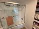 Bathroom with a shower/tub combo and linen shelves at 3806 Gulf Of Mexico Dr # C310, Longboat Key, FL 34228