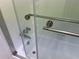 Updated bathroom with a glass shower door and built-in shelving at 3806 Gulf Of Mexico Dr # C310, Longboat Key, FL 34228