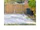 Gravel backyard with wooden fence and storage area at 5340 5Th S Ave, St Petersburg, FL 33707