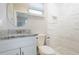 Updated bathroom with granite vanity and a walk-in shower at 5340 5Th S Ave, St Petersburg, FL 33707