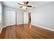 Well-lit bedroom with hardwood floors, double doors and ceiling fan at 5340 5Th S Ave, St Petersburg, FL 33707