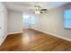 Bright bedroom with hardwood floors and ceiling fan at 5340 5Th S Ave, St Petersburg, FL 33707