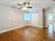 Spacious bedroom featuring hardwood floors and ceiling fan at 5340 5Th S Ave, St Petersburg, FL 33707