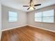 Bright bedroom with hardwood floors, ceiling fan, and ample window light at 5340 5Th S Ave, St Petersburg, FL 33707