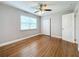 Spacious bedroom featuring hardwood floors, ceiling fan and neutral walls at 5340 5Th S Ave, St Petersburg, FL 33707