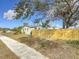 House exterior with landscaped yard and wooden fence at 5340 5Th S Ave, St Petersburg, FL 33707