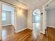 Bright hallway with hardwood floors and archway leading to living area at 5340 5Th S Ave, St Petersburg, FL 33707